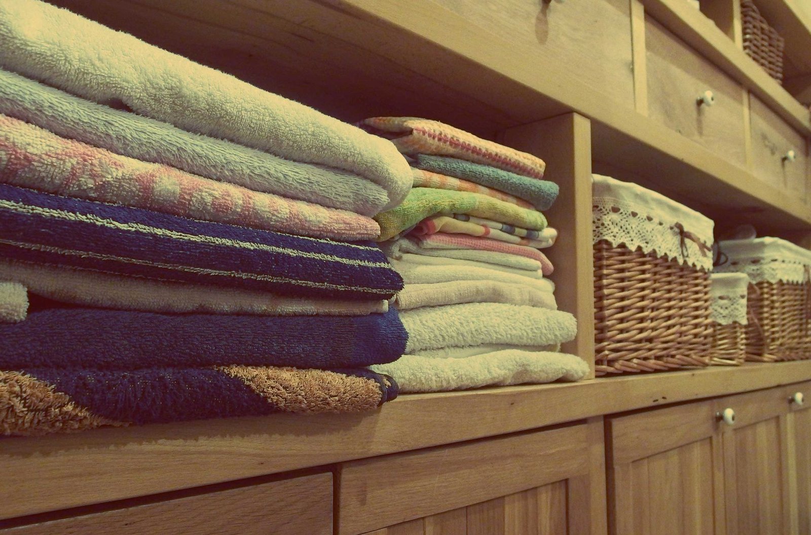 Neatly arranged bedroom textiles suitable for guest rooms and holiday accommodation
