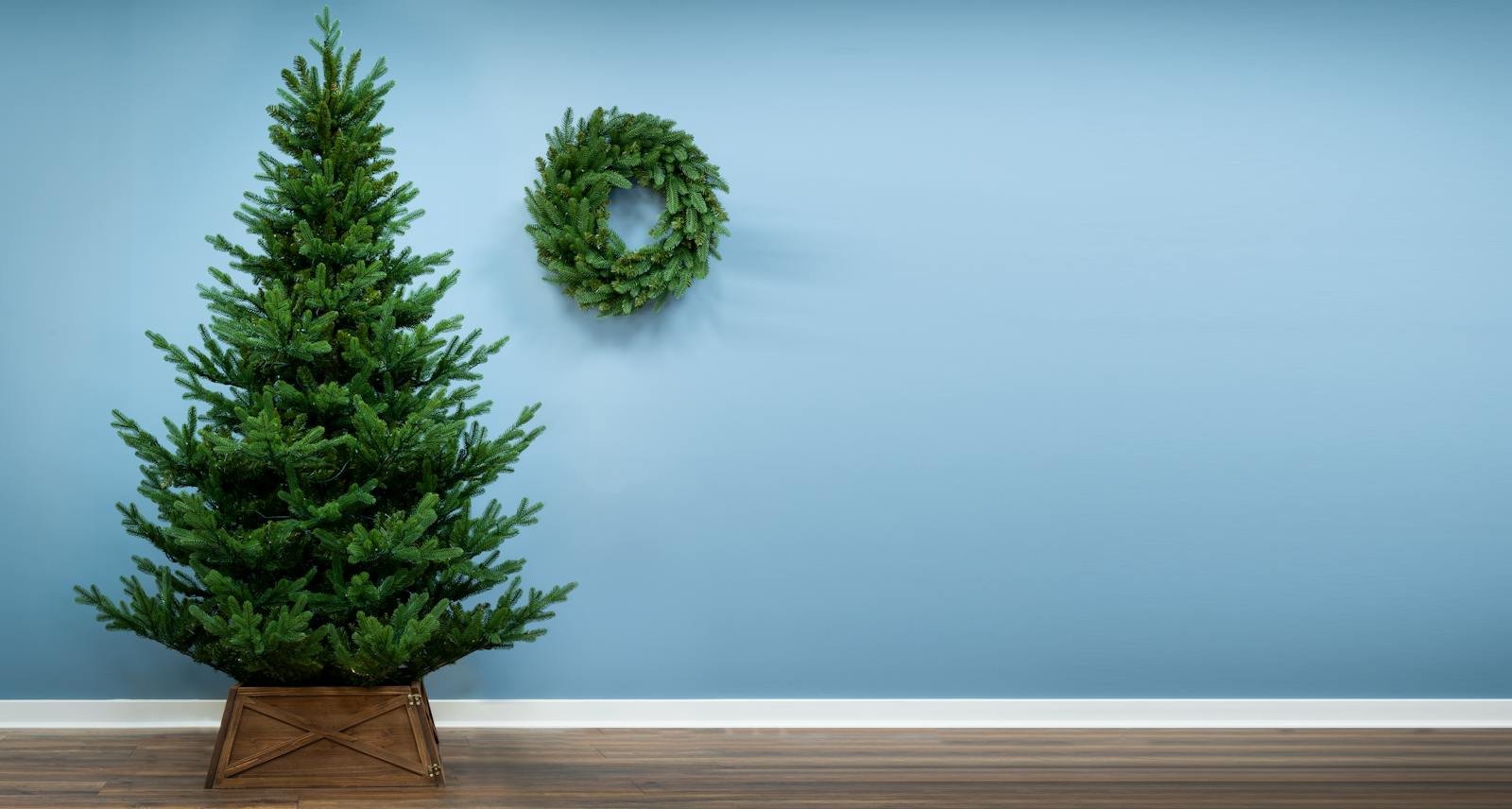 Full artificial Christmas tree with layered branches and seasonal ornaments