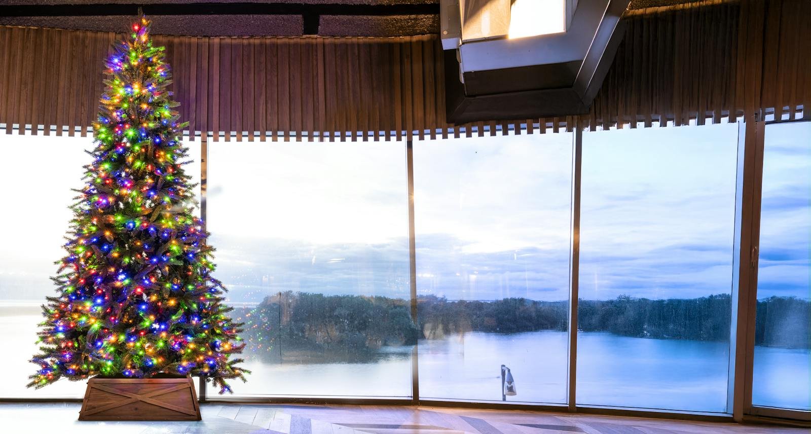 Close view of an artificial Christmas tree arranged with festive lights